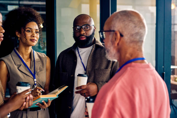 istock Multicultural business team during a coffee break in a corporate setting. Casual networking and employee engagement concept. 2153221925