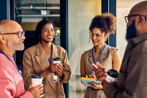 istock Multicultural business team during a coffee break in a corporate setting. Casual networking and employee engagement concept. 2153221941