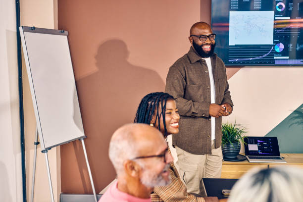 istock Multiracial business team in a meeting with data analysis presentation in a modern office. Corporate strategy and analytics concept 2153221977