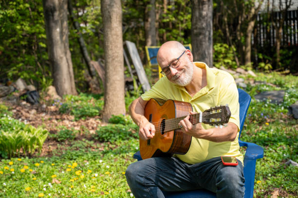 istock Mature man and guitar 2153223304