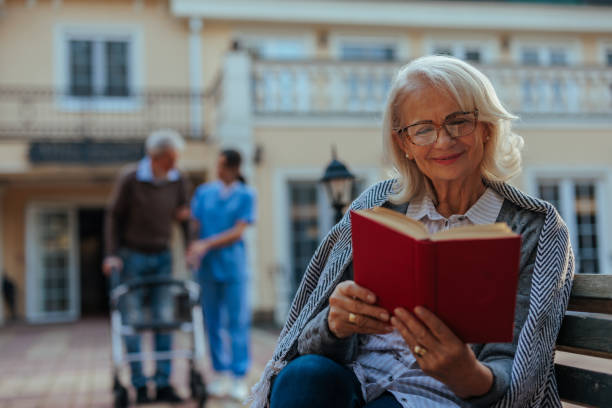 istock Cheerful elderly woman in nursing home yard. 2153224137