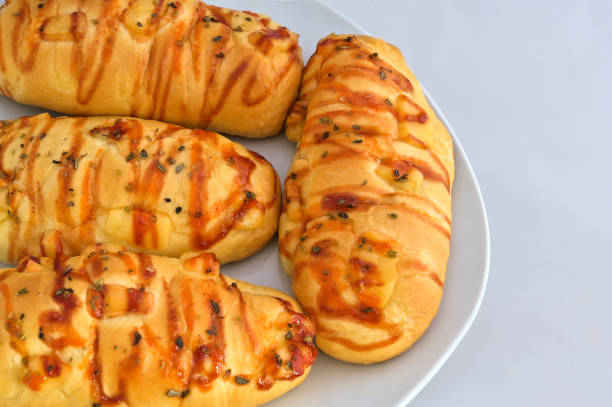 Soft and fluffy pizza bun loaded with melted cheese and colorful toppings. Ideal for snacks or food menu visuals.