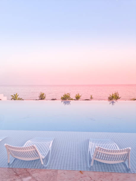 Sunset in a swimming pool by the sea