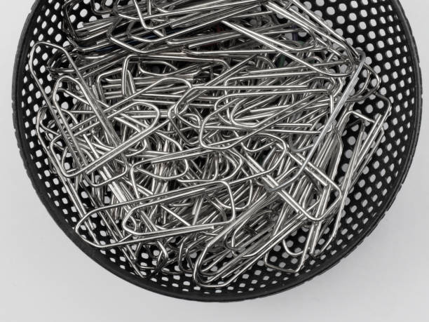 Image of silver paper clips isolated on white background