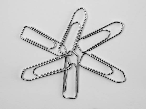 Image of silver paper clips isolated on white background