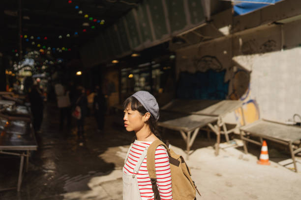 istock Asian woman exploring the new city while on a vacation 2153231999
