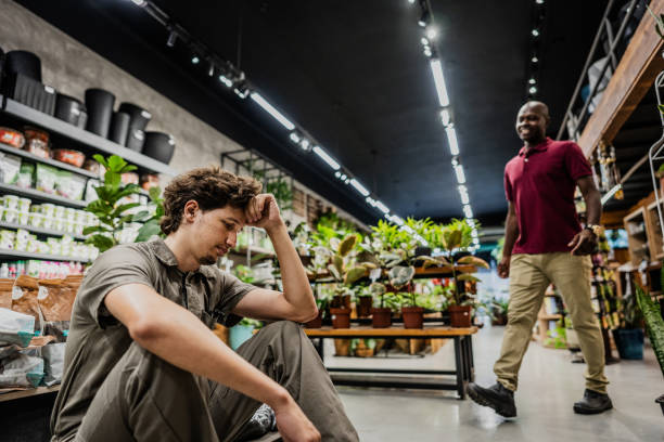 istock Boss going talk to sad employee at flower shop 2153232152