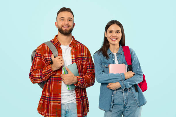 istock Cheerful Guy And Lady Holding Books Posing With Backpacks, Studio 2153233103