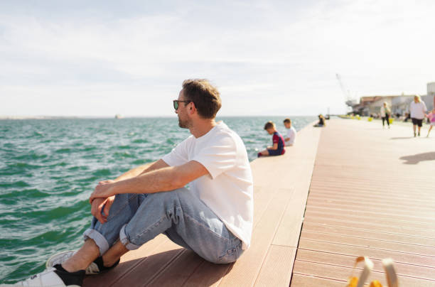 Man sitting on the pier
