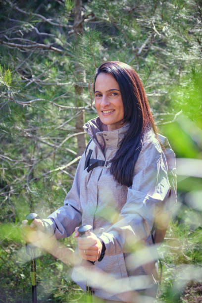 istock Smiling Hispanic woman with backpack in nature 2153236912