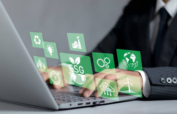 istock Women use a laptop computer to analyze ESG icon.plan to renewable resources to reduce pollution and carbon emission ,ESG environment social governance investment business concept. 2153241432