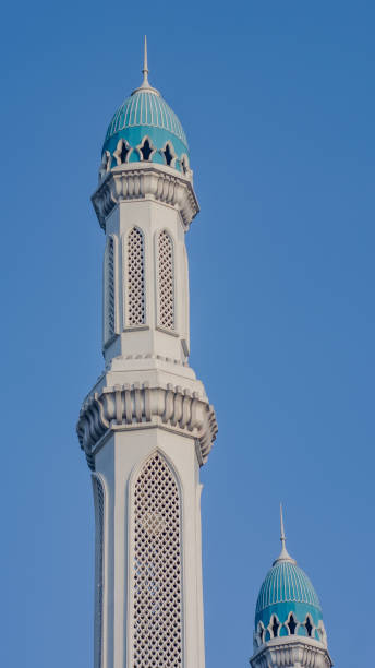 istock Majestic Mosque Minarets Against Blue Sky 2153241448