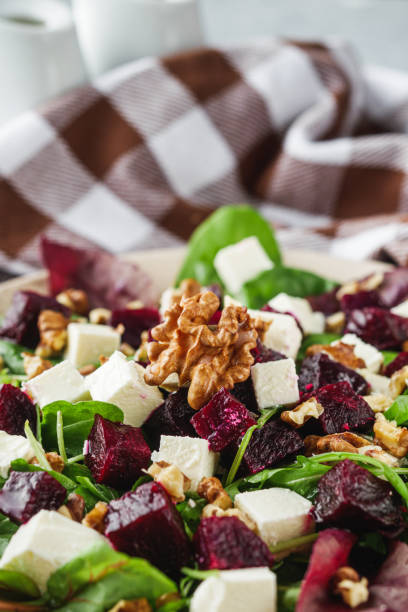 delicious fresh beet salad on a light stone background.