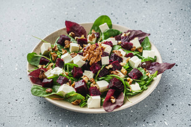 delicious fresh beet salad on a light stone background.