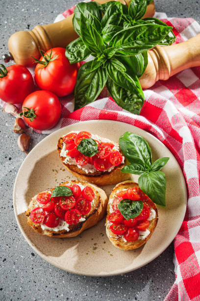 istock delicious Italian bruschetta with tomatoes on a light stone background 2153243551