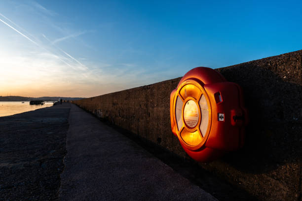 Life buoy on coastal railing at Brixham, UK