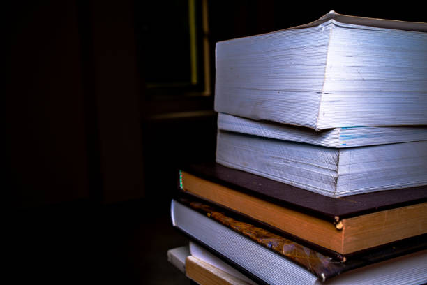 Books on the desk evoke an intellectual ambiance, fostering a love for literature and creating an organized space for study.