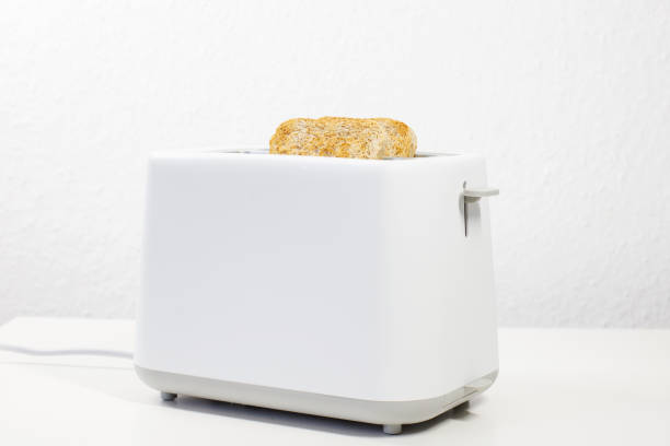 Bright Yellow Toaster with Bagel Inside