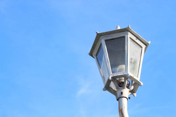 Street lamp in Yogyakarta with blue sky background. Old style metal electricity lamp