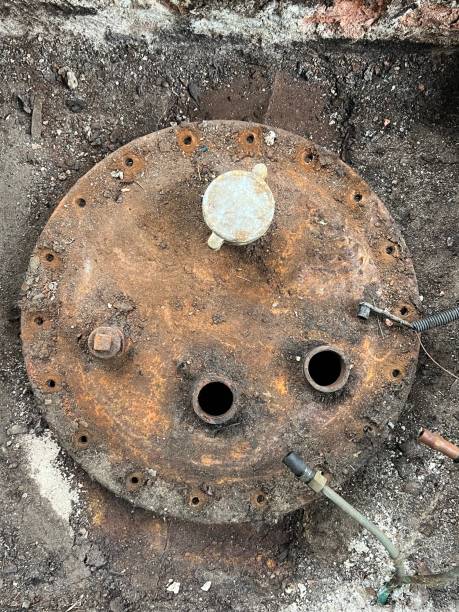 istock Washing and making safe an old underground diesel tank 2153250903