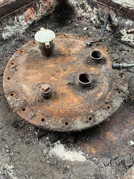 istock Washing and making safe an old underground diesel tank 2153250913
