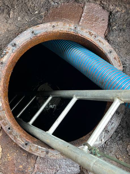 istock Washing and making safe an old underground diesel tank 2153250951
