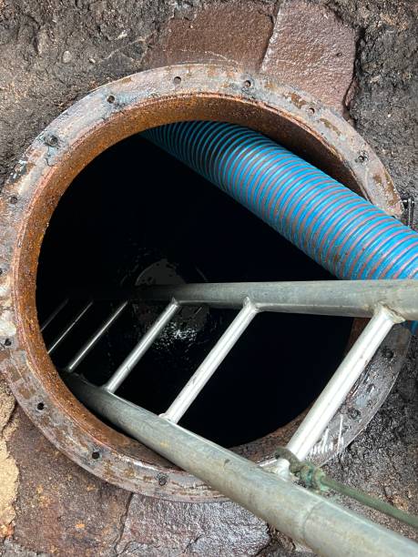 istock Washing and making safe an old underground diesel tank 2153250965