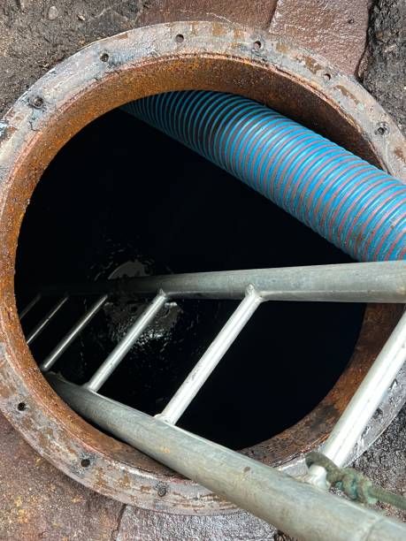 istock Washing and making safe an old underground diesel tank 2153250969