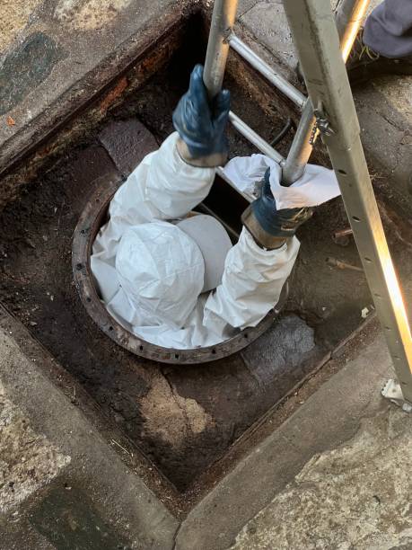 istock Washing and making safe an old underground diesel tank 2153251030