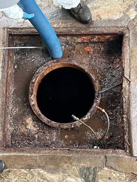 istock Washing and making safe an old underground diesel tank 2153251041