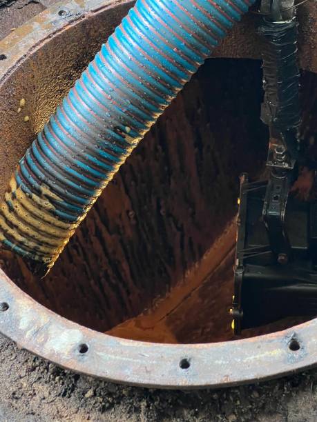 istock Washing and making safe an old underground diesel tank 2153251232