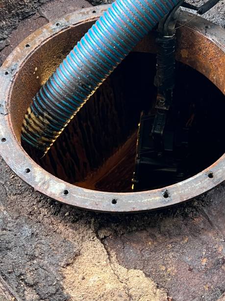istock Washing and making safe an old underground diesel tank 2153251236
