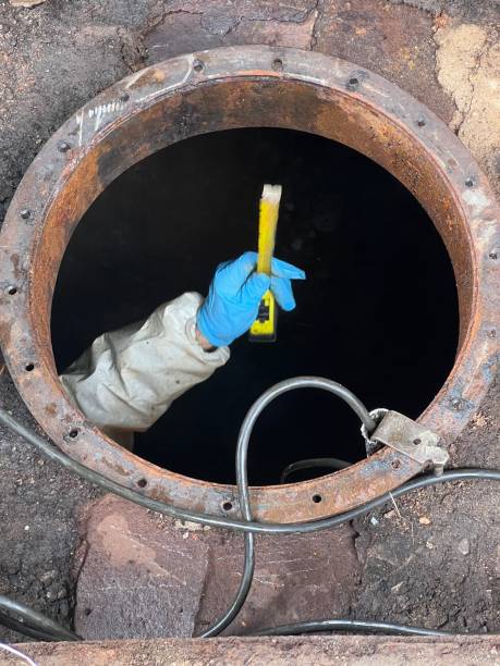 istock Washing and making safe an old underground diesel tank 2153251265