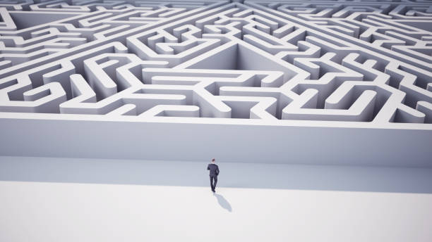 istock Businessman Going Towards Triangle Shaped Maze 2153252432
