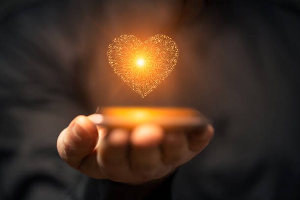 istock Artificial intelligence heart symbol on a smartphone held by a man 2153254343
