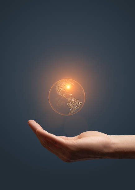 istock Artificial intelligence earth symbol in hand on dark background 2153255474