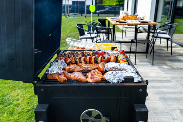 istock A modern rectangular grill standing on a paving slab on a garden terrace. 2153256457