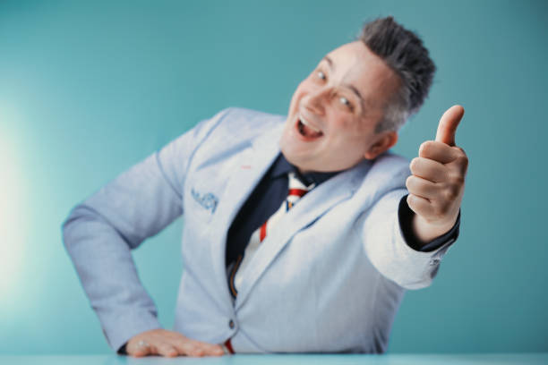 istock Thumbs up from man celebrating professional success 2153257947