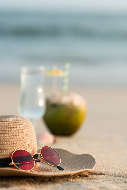 istock Sunglass with straw hat on the beach 2153261150