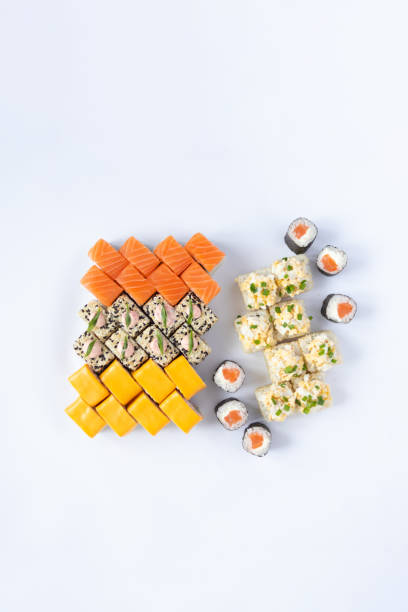 istock Sushi delivery. Set of rolls in a disposable box on a black background. Top view 2153263683