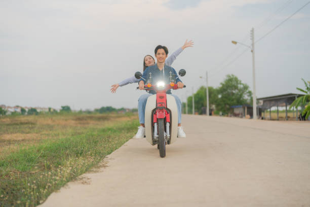 istock Joyful couple on motorcycle adventure 2153269232