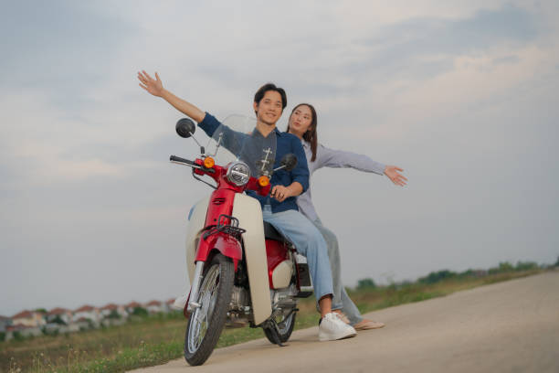 istock Young couple enjoying a motorcycle ride at dusk 2153269235