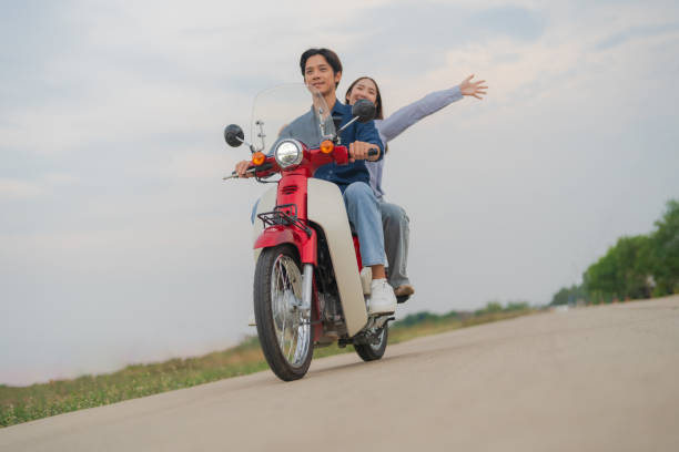 istock Joyful couple on motorcycle adventure 2153269249