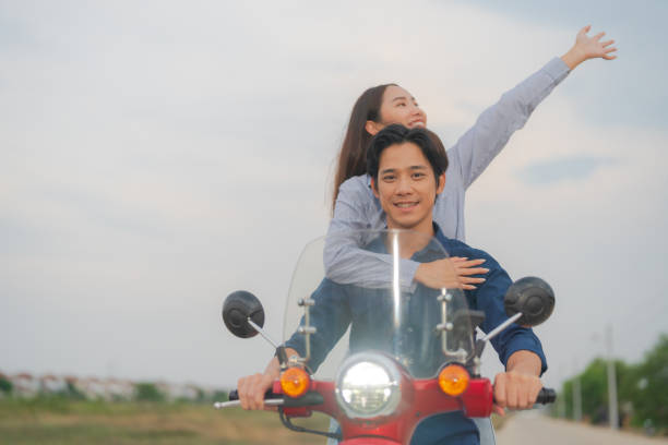 istock Joyful couple on motorcycle adventure 2153269703