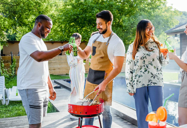 istock Friends having barbecue on a summer day 2153270419