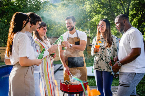 istock Friends having a barbecue party by the pool 2153271504