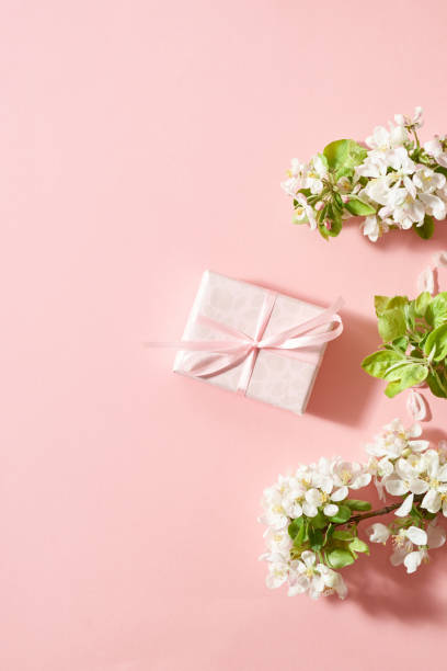 istock Spring flowers and  gift box on a pink background 2153271740
