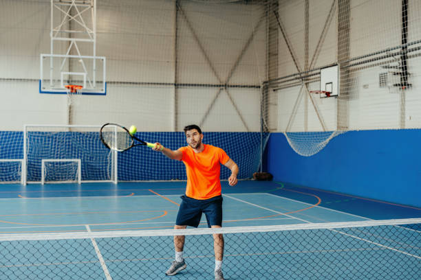 istock A man holding a tennis racket and a ball 2153273181