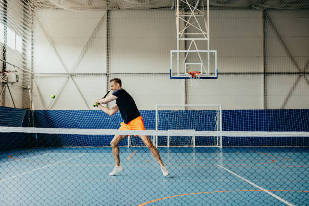 istock A man swinging a tennis racket 2153273217