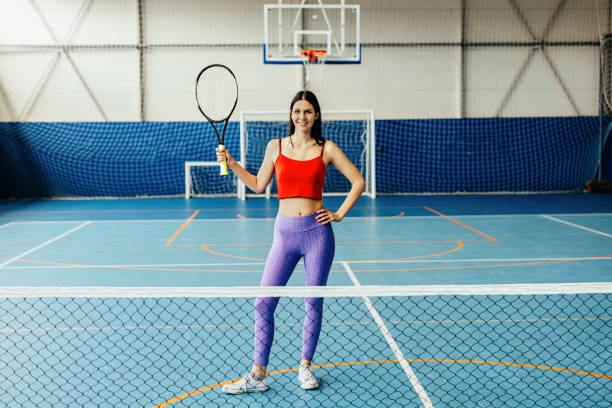 istock A woman holding a tennis racket 2153273248
